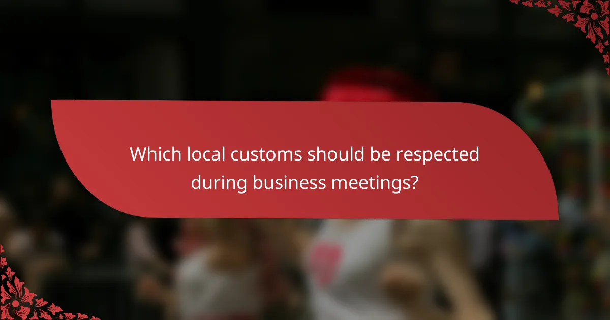 Which local customs should be respected during business meetings?